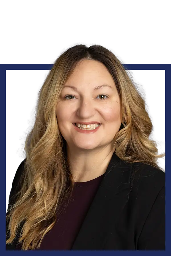 Rachel Beauchamp smiling in a black suit coat.